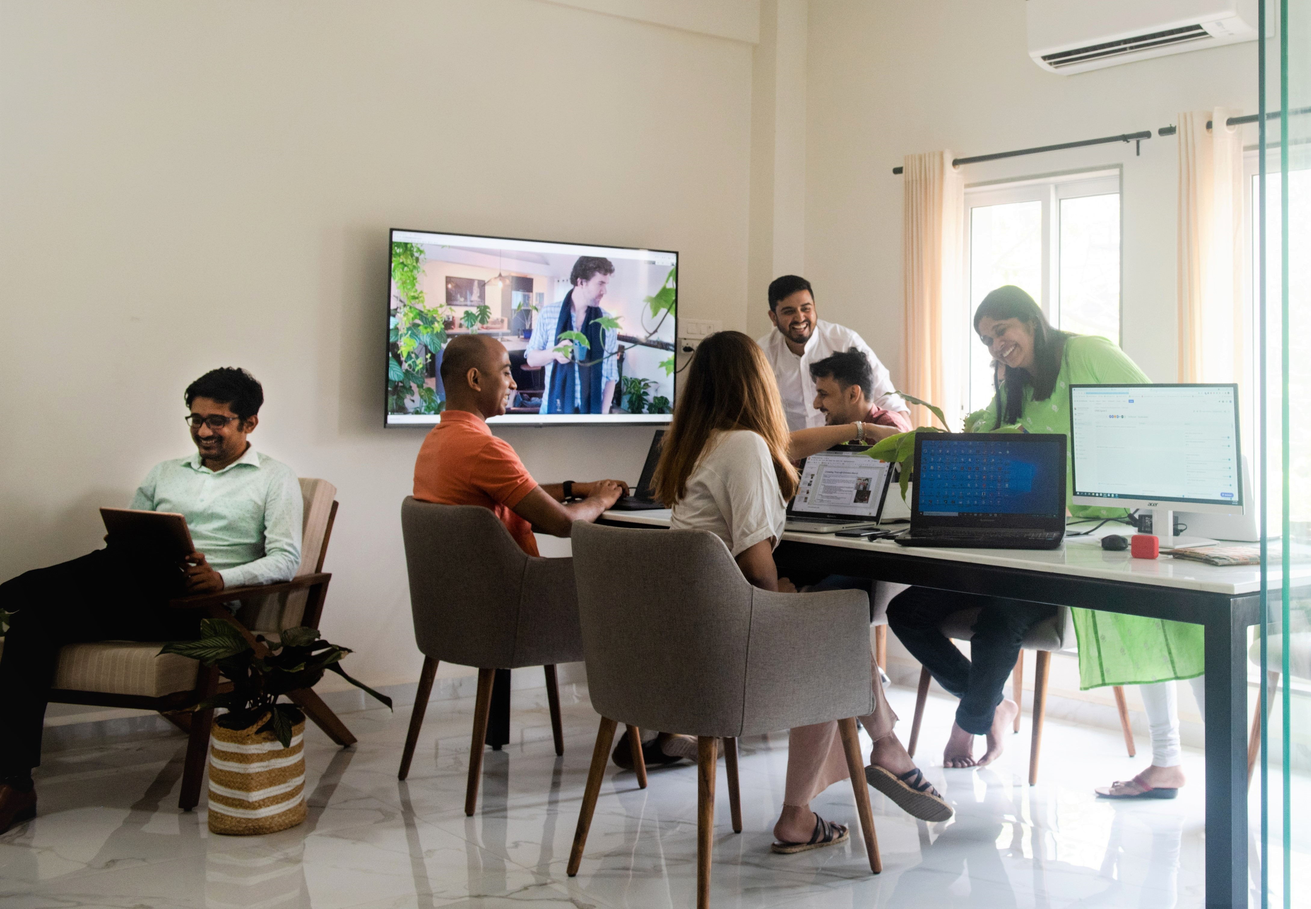 Antarctica Global Team working around the table at Mumbai office