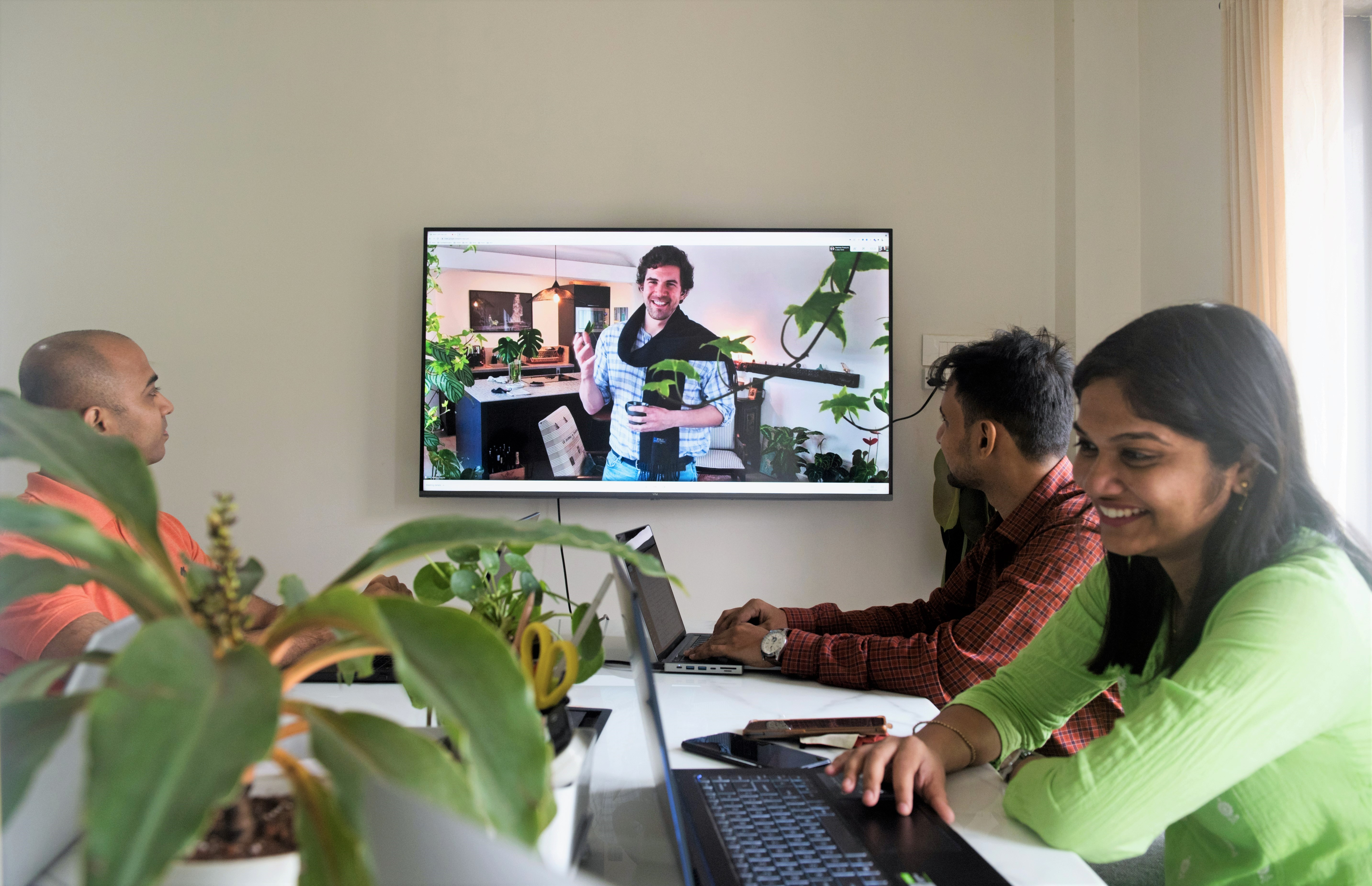  Antarctica Global Team working around table with cofounder on 4K office screen