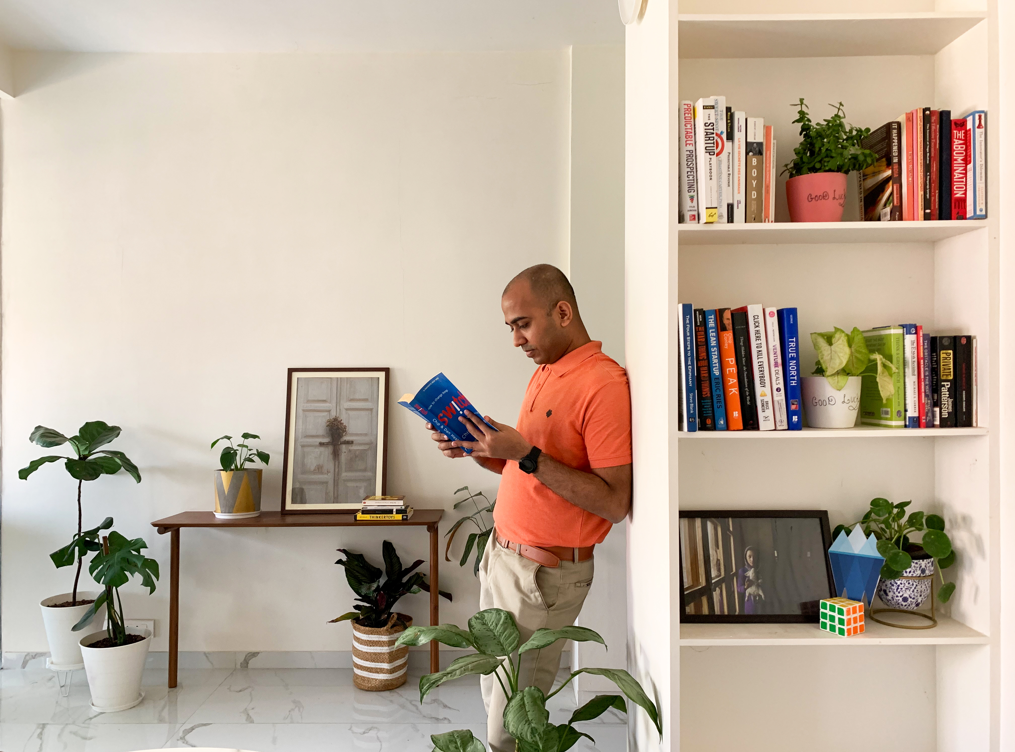 Employee reading a book at the library of Antarctica Global Office in Mumbai