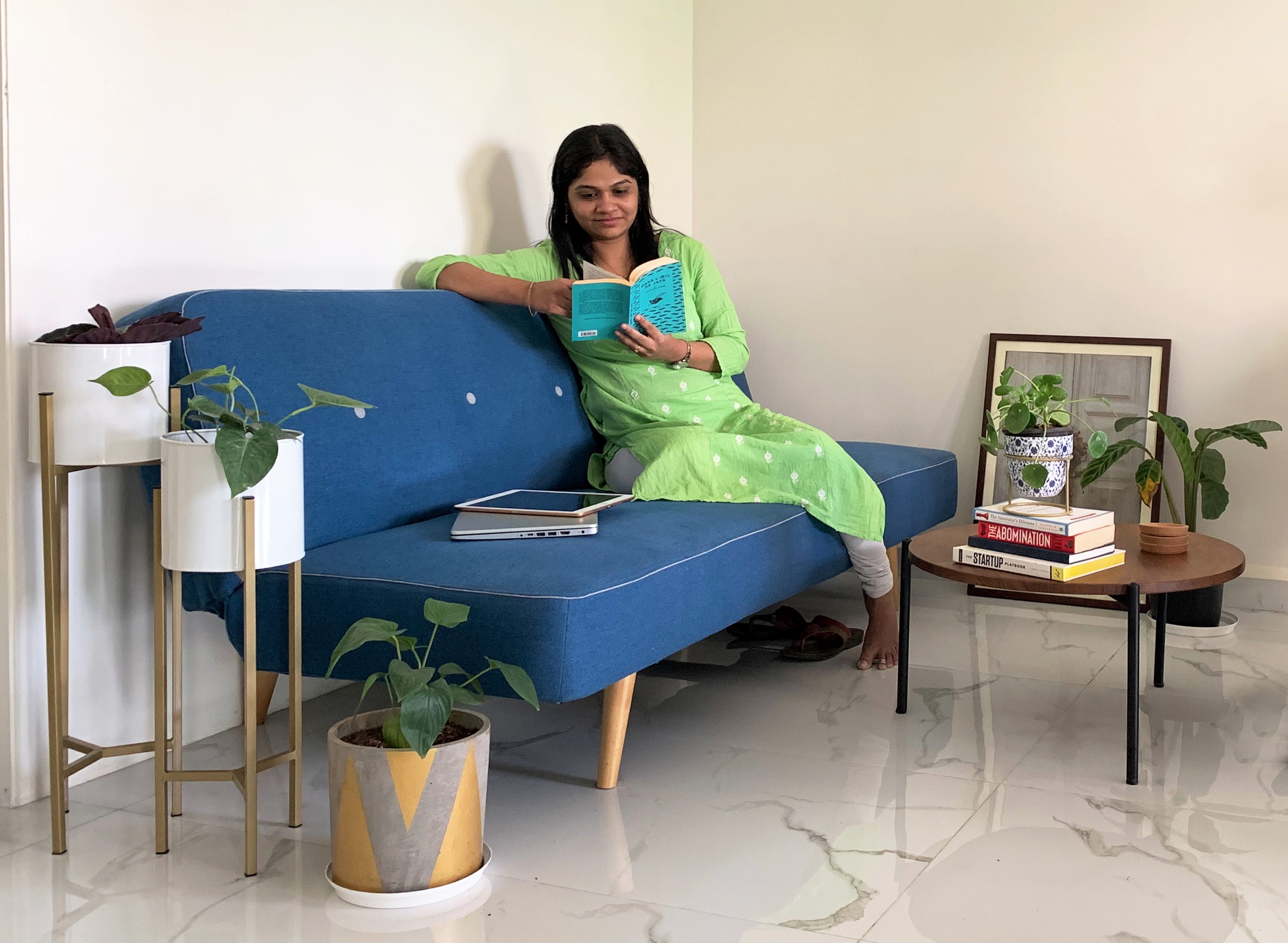  Employee reading a book in chill lounge of Antarctica Global Mumbai Office